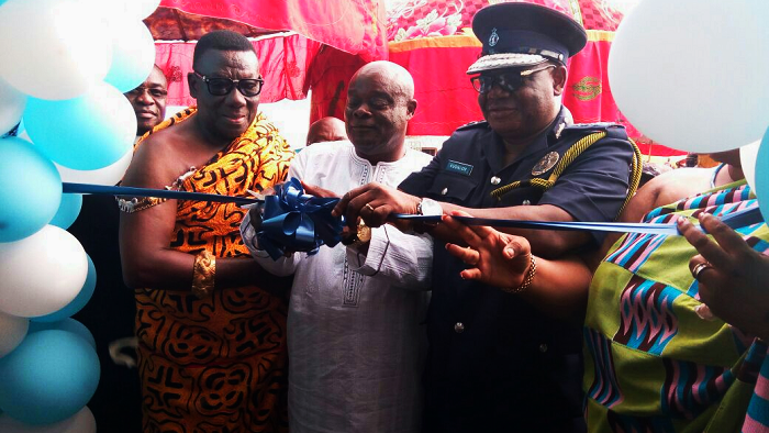 Mr John Kudalor (right), the Inspector-General of Police, being assisted by the Mamponghene, Daasebre Osei Bonsu II, and Mr Yaw Amponsah Marfo (middle), the Chief Executive Officer of Yesu Dea Transport, to cut the tape to inaugurate the police station. Below is the front view of the police station. Mr John Kudalor (right), the Inspector-General of Police, being assisted by the Mamponghene, Daasebre Osei Bonsu II, and Mr Yaw Amponsah Marfo (middle), the Chief Executive Officer of Yesu Dea Transport, to cut the tape to inaugurate the police station. Below is the front view of the police station.